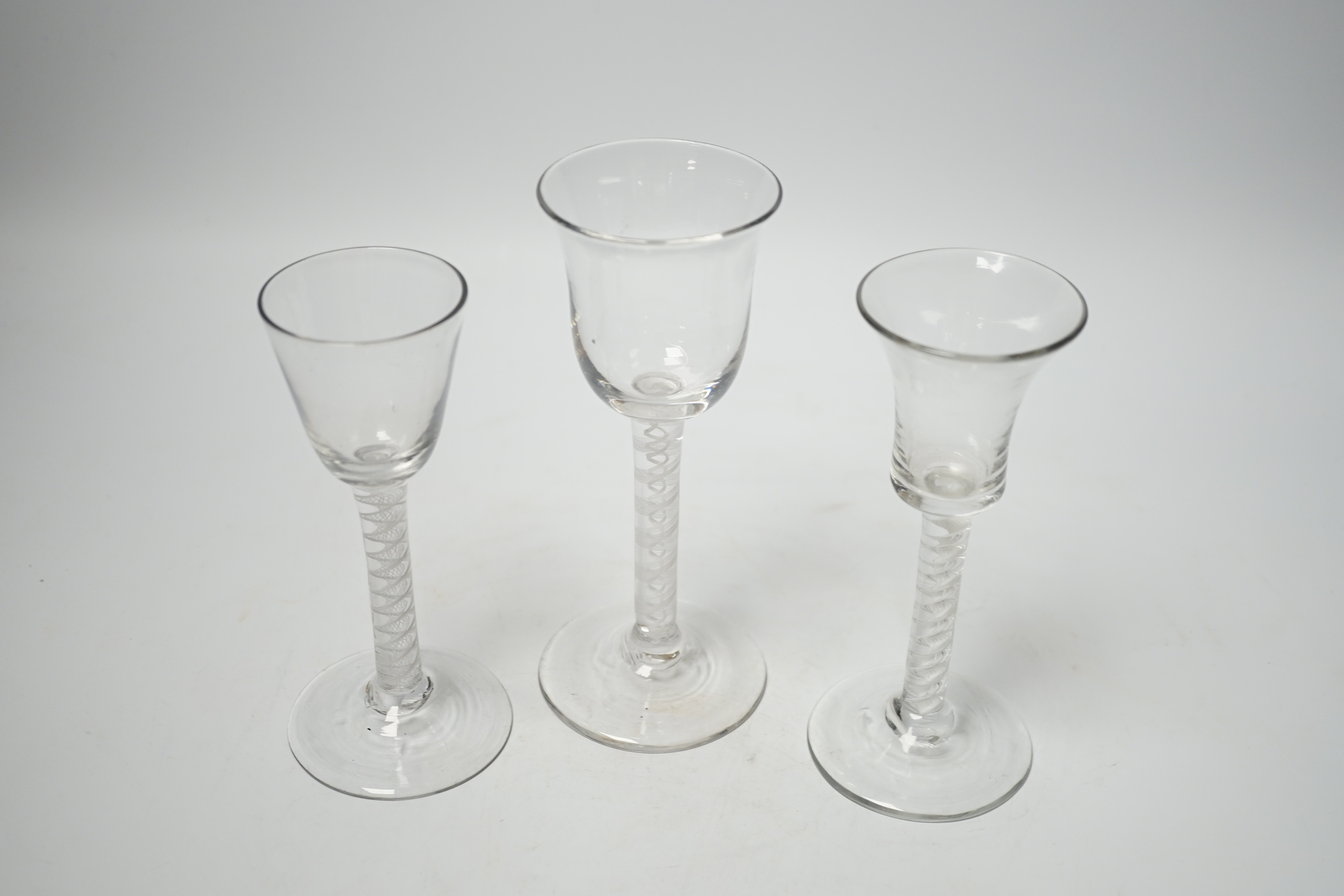 Three 18th century wine glasses with DSOT stems, two examples with bell-shaped bowls, tallest, 17cm